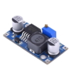 LM2596S DC-DC Buck Converter Power Supply module on a white background, emphasizing its compact design and electrical connections.
